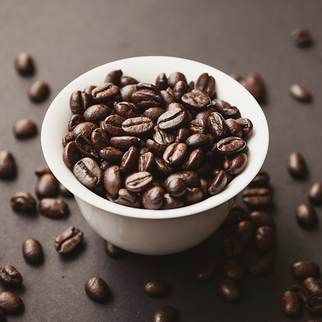 coffee beans in a white cup