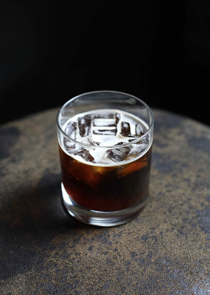 glass of iced coffee on a wooden table