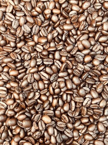 closeup of a big pile of roasted coffee beans for the guess how many in the mason jar game