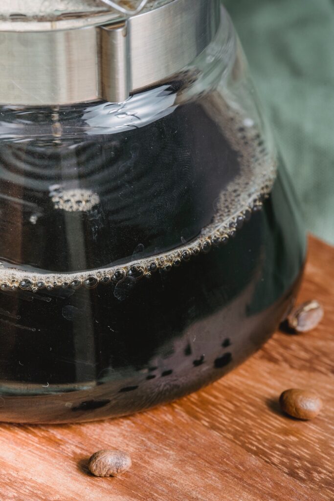 closeup of coffee percolating into a pot