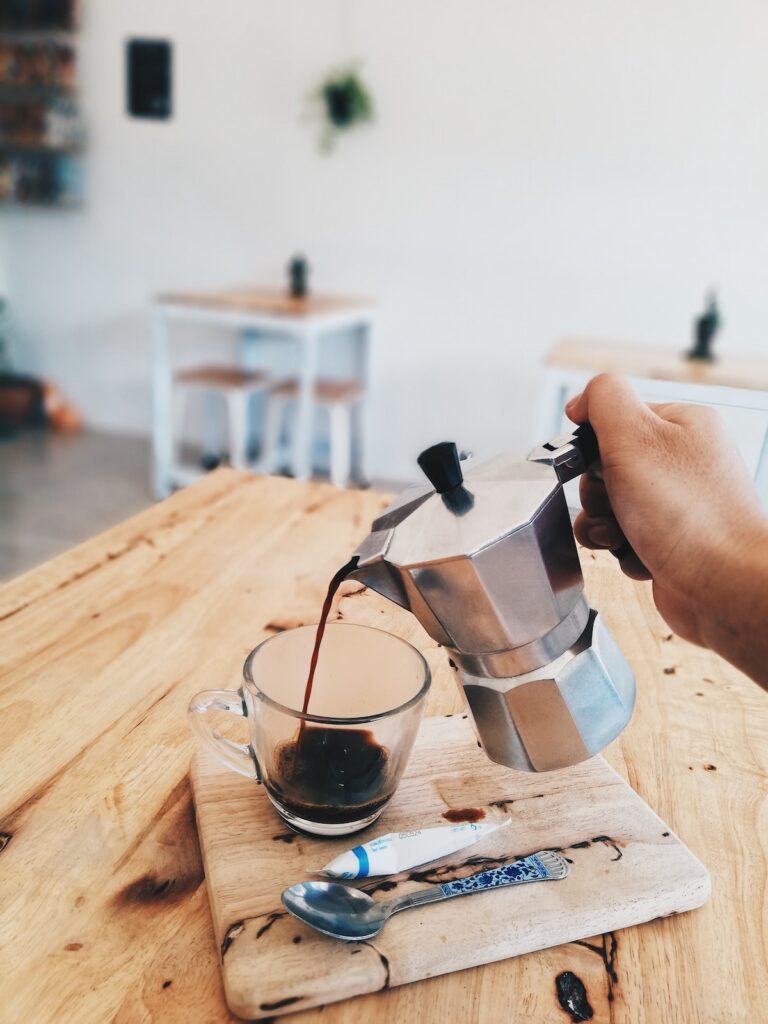 turkish coffee pot pouring into a cup