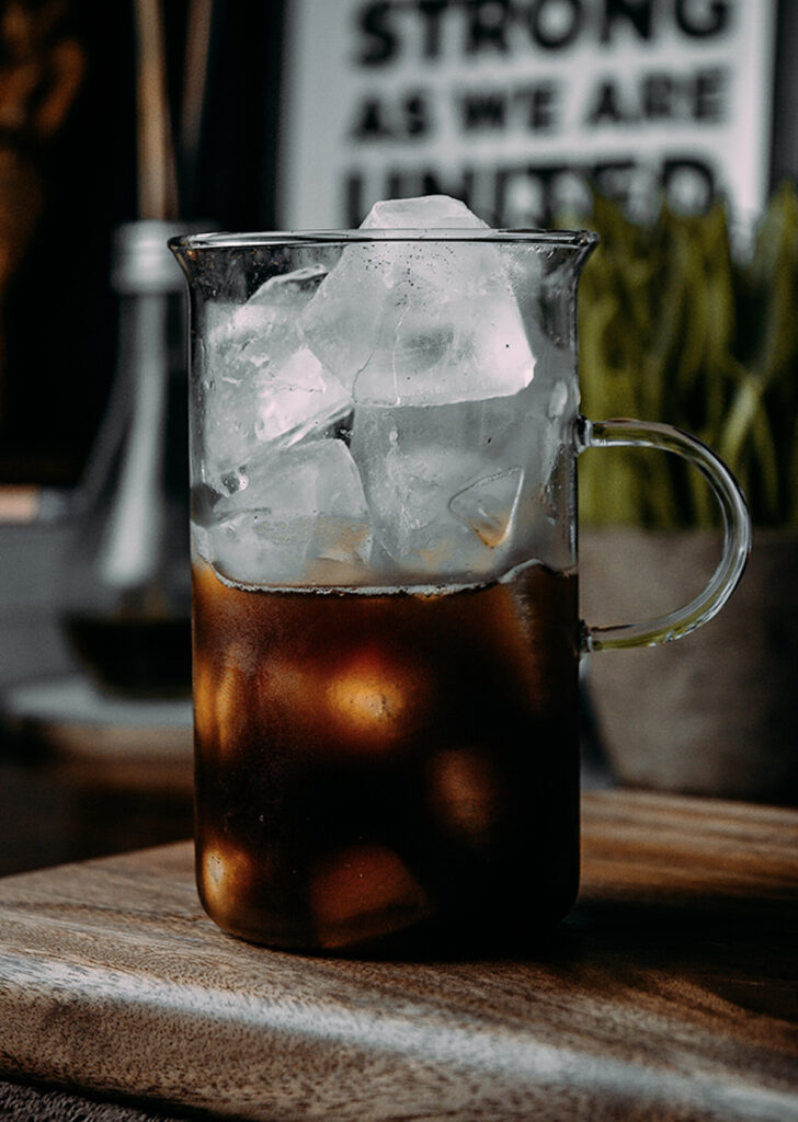 iced coffee in a tall glass mug