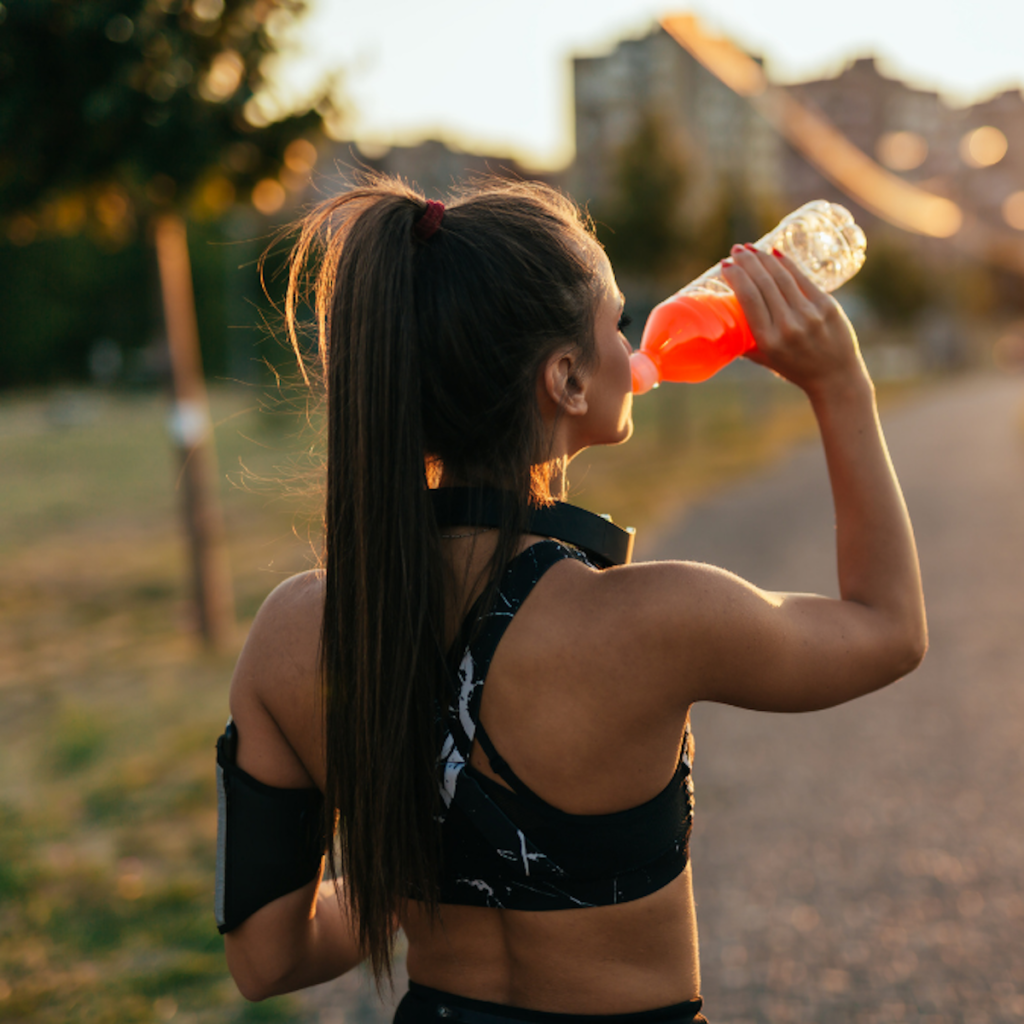 woman drinking while working out