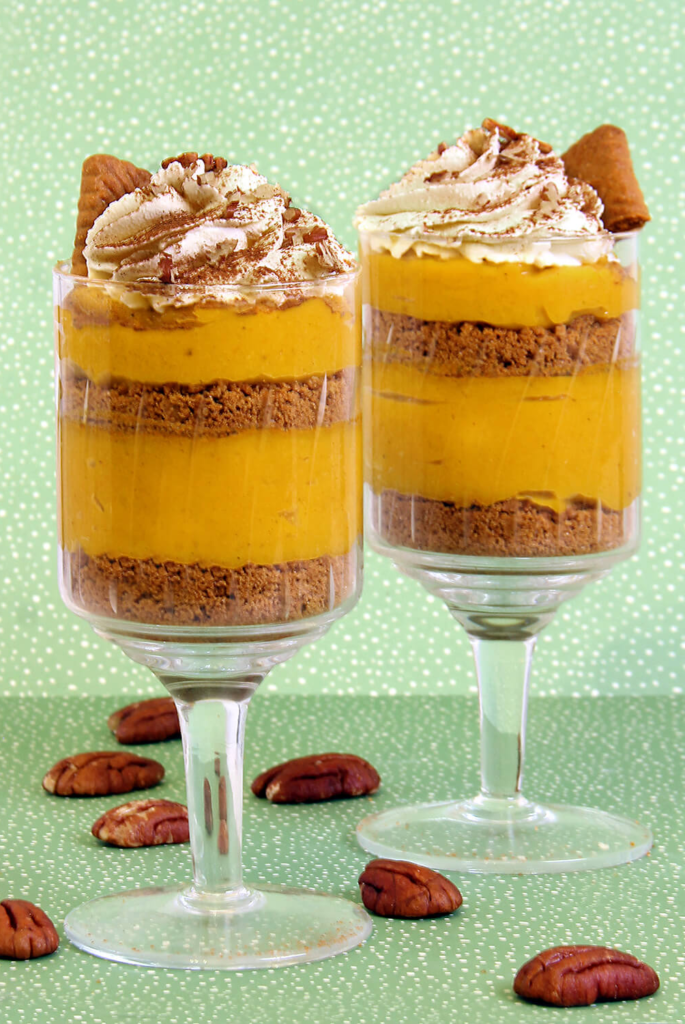 2 creamy pumpkin mousse dessert cups with light aqua and white polka dot background flavor portal