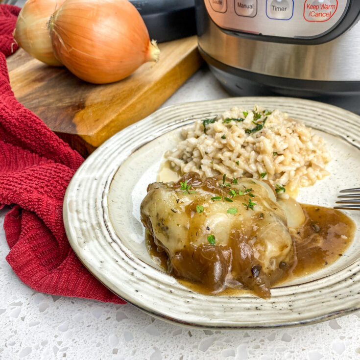 Instant Pot French onion chicken on a plate with rice