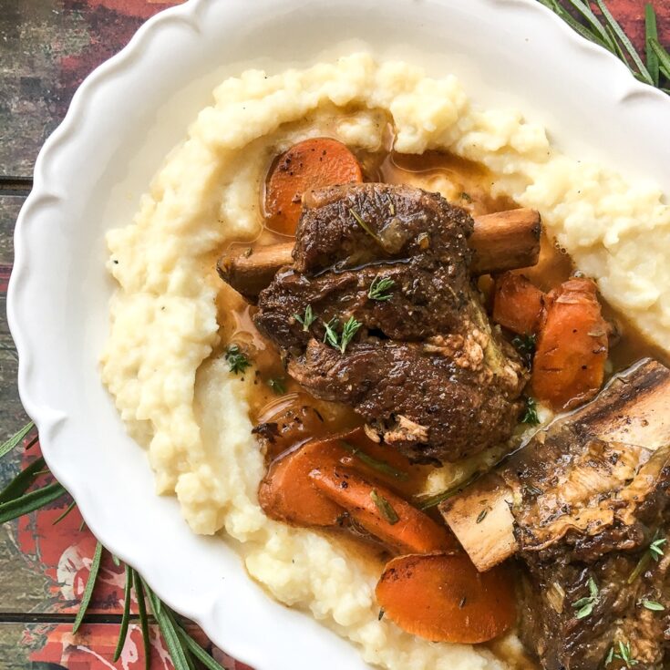 Instant Pot beef short ribs from Flavor Portal recipe on a bed of mashed potatoes