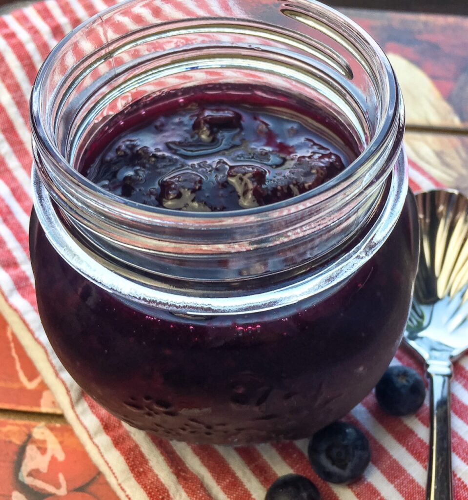 instant pot blueberry maple compote in small mason jar