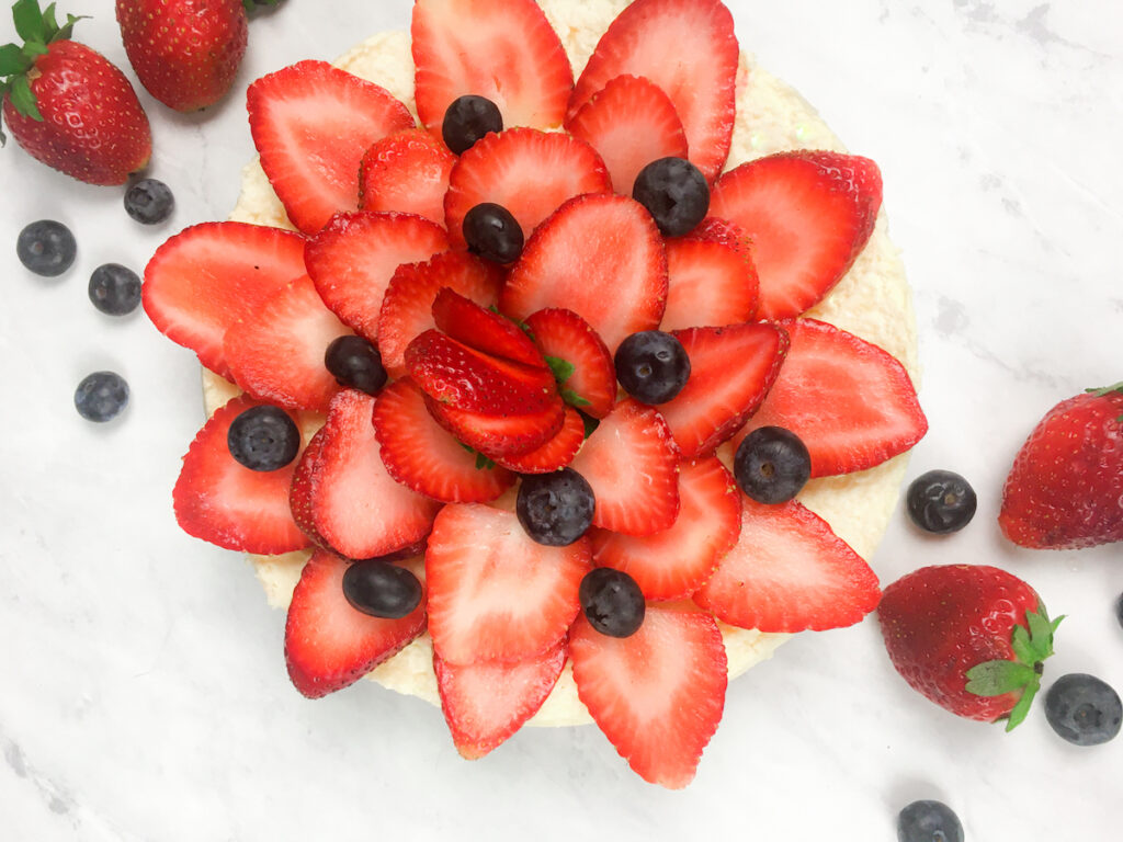 Instant Pot Cheesecake from Flavor Portal recipe topped with sliced strawberries and blueberries