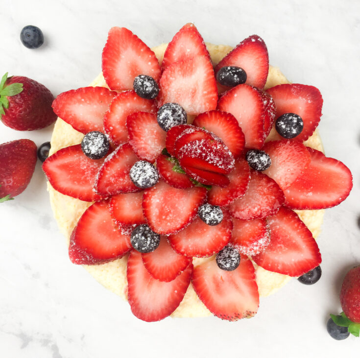 Instant Pot Cheesecake from Flavor Portal recipe topped with sliced strawberries and blueberries