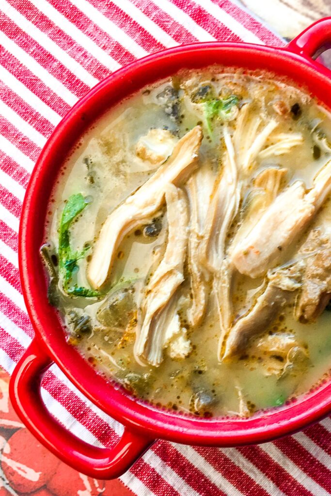 Instant Pot Chicken Florentine Soup from Flavor Portal recipe in a red ceramic bowl