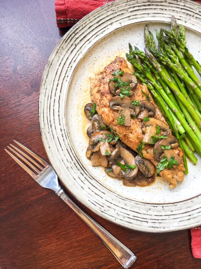 Instant Pot Chicken Lanzone from Flavor Portal recipe on vintage plate with asparagus spears