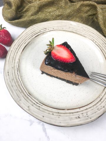 Instant Pot Chocolate Cheesecake on a vintage white stoneware plate