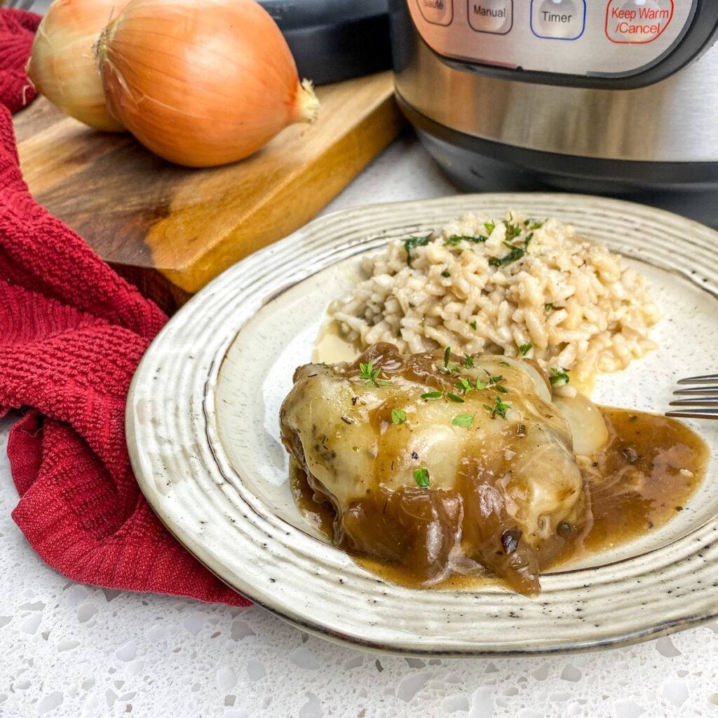 Instant pot French onion chicken on  a plate with rice pilaf for flavor portal