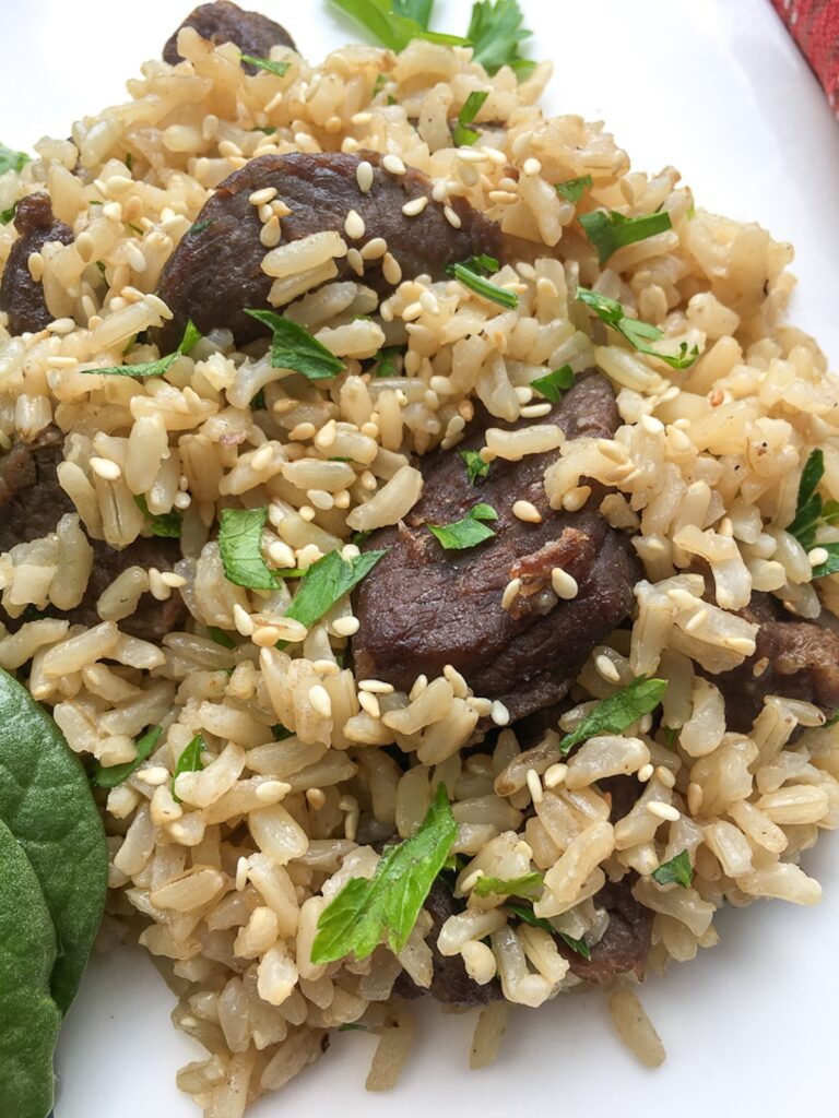 closeup Instant Pot one pot beef and rice from Flavor Portal recipe on a white plate