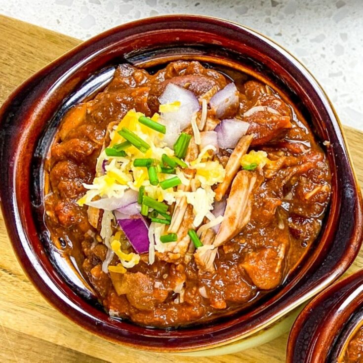 instant pot pulled pork chili in a bowl with garnishments for flavor portal