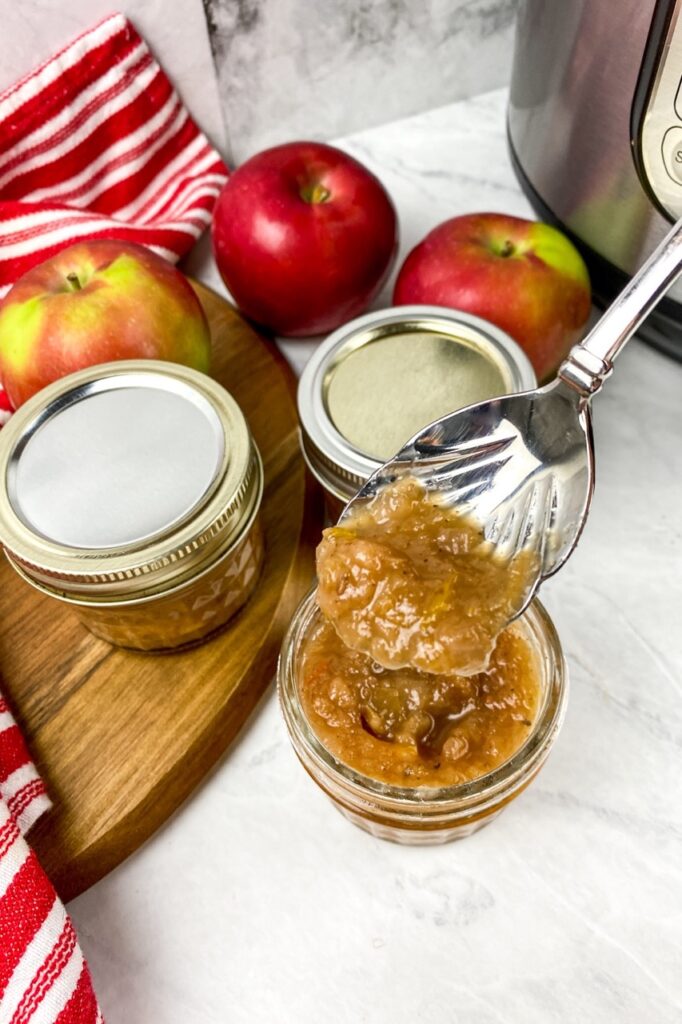 Instant pot savory apple chutney in small jars and a spoon for flavor portal