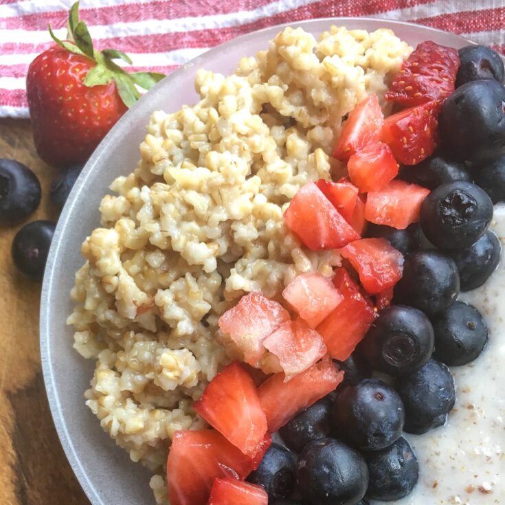 Instant Pot Steel Cut Oats from Flavor Portal recipe with cream, blueberries and chopped strawberries
