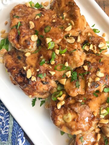 Instant Pot Thai chicken thighs on a white plate