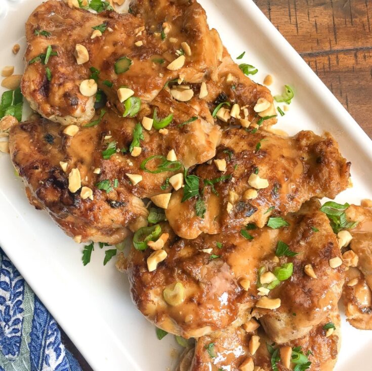 White plate of Instant Pot Thai chicken thighs