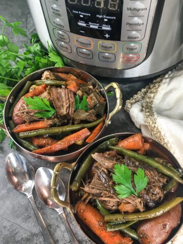 two bowls of Instant Pot traditional pot roast from Flavor Portal recipe in front of an Instant Pot