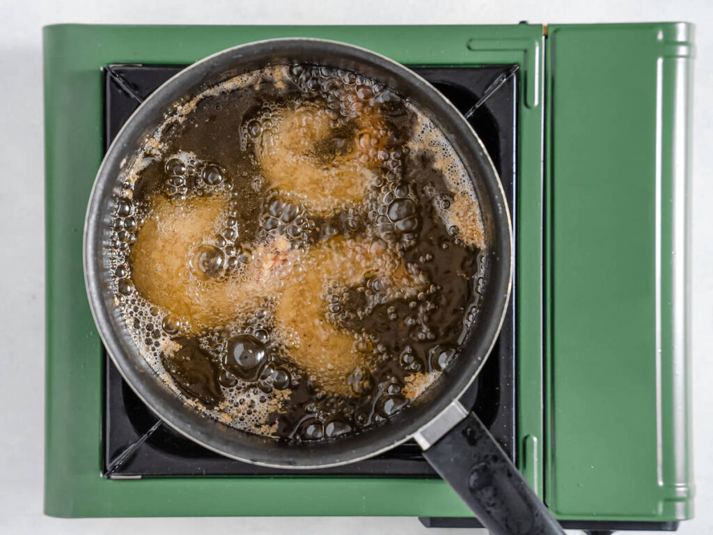 Lemon Panko Fried Shrimp process showing three lemon panko shrimp frying in a pot
