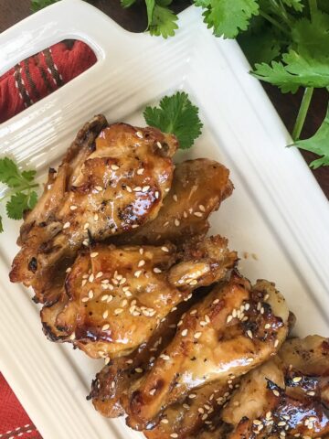 Sesame chicken wings from a Flavor Portal recipe on a long rectangular white platter
