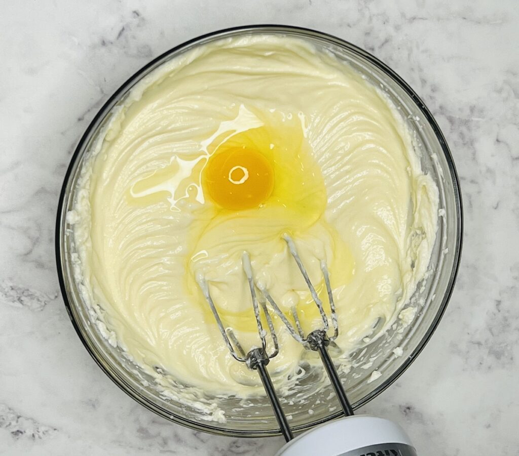 creamy cheesecake mixture with second egg