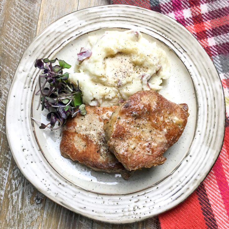 Instant Pot boneless pork chops from Flavor Portal recipe with creamy mashed potatoes and microgreens