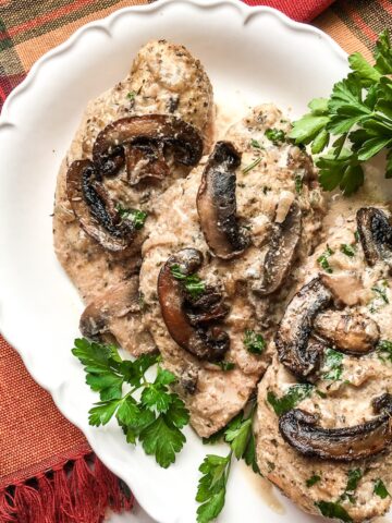 Instant pot chicken marsala on a white plate for flavor portal