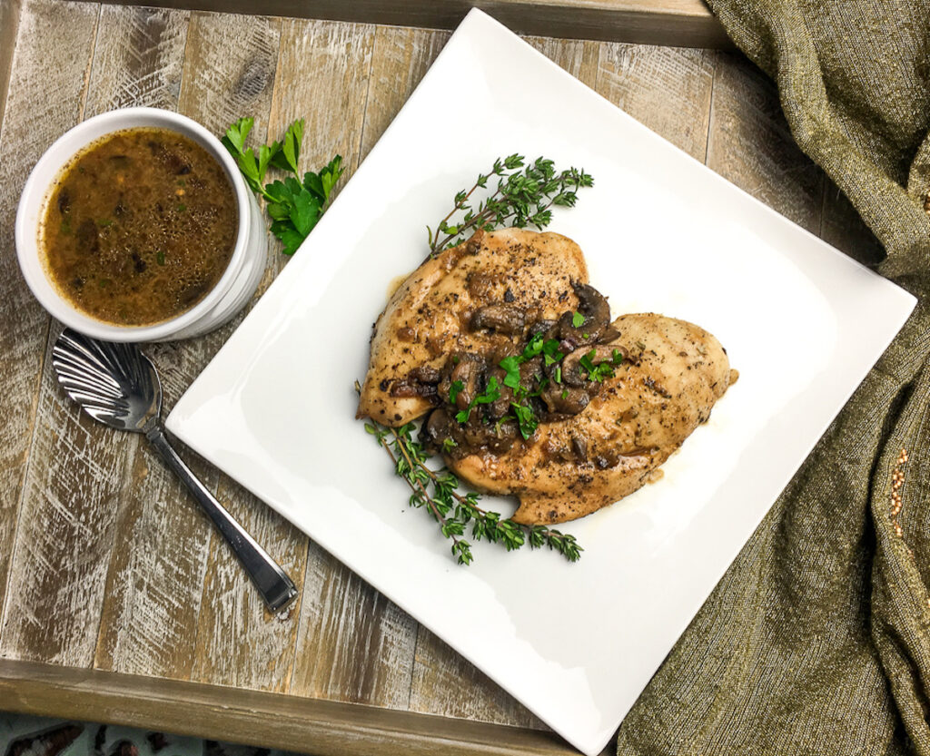 Instant Pot Italian Chicken Breasts from Flavor Portal recipe topped with mushrooms with thyme twigs