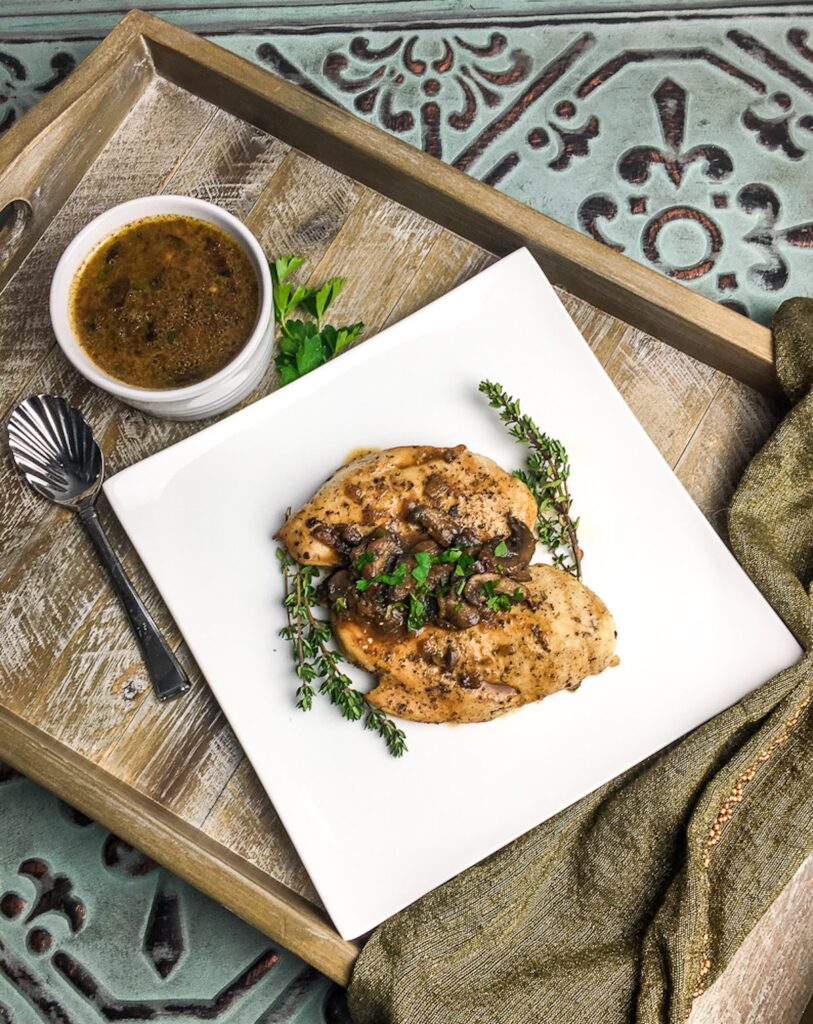 Instant Pot Italian Chicken Breasts from Flavor Portal recipe topped with mushrooms with thyme twigs