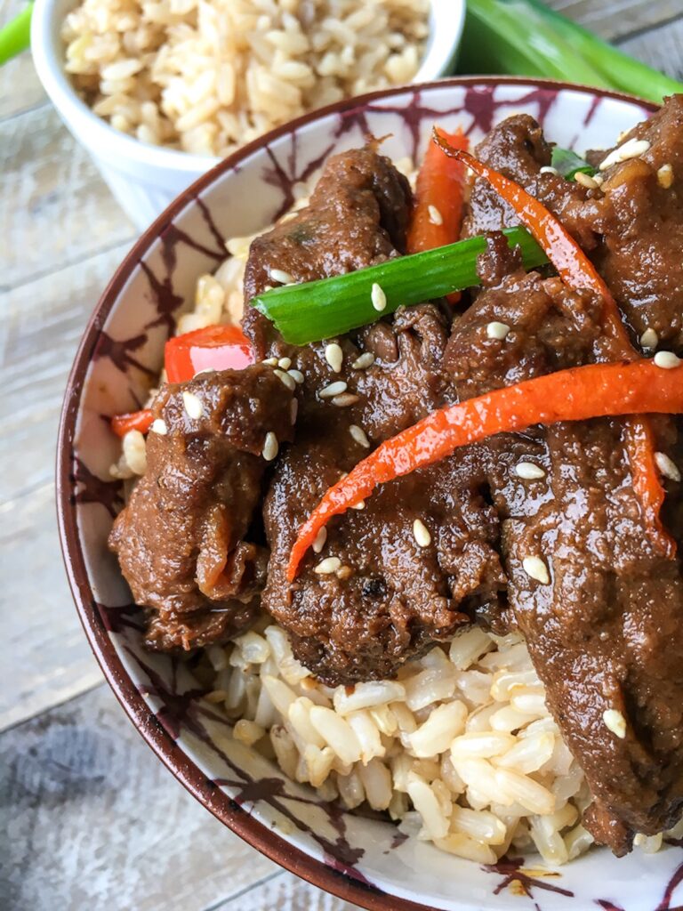 Instant Pot mongolian beef from Flavor Portal recipe on rice in a bowl