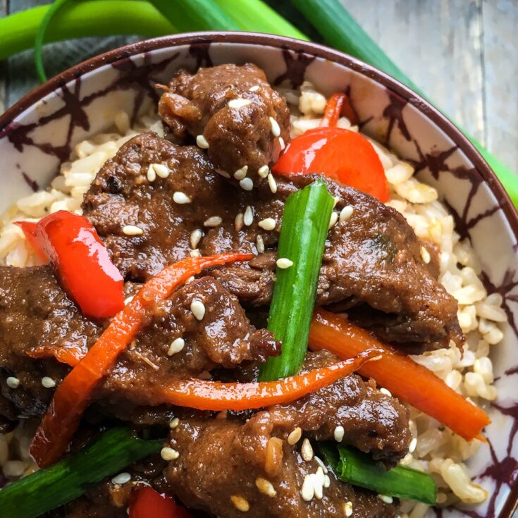 Instant Pot mongolian beef from Flavor Portal recipe on rice in a bowl