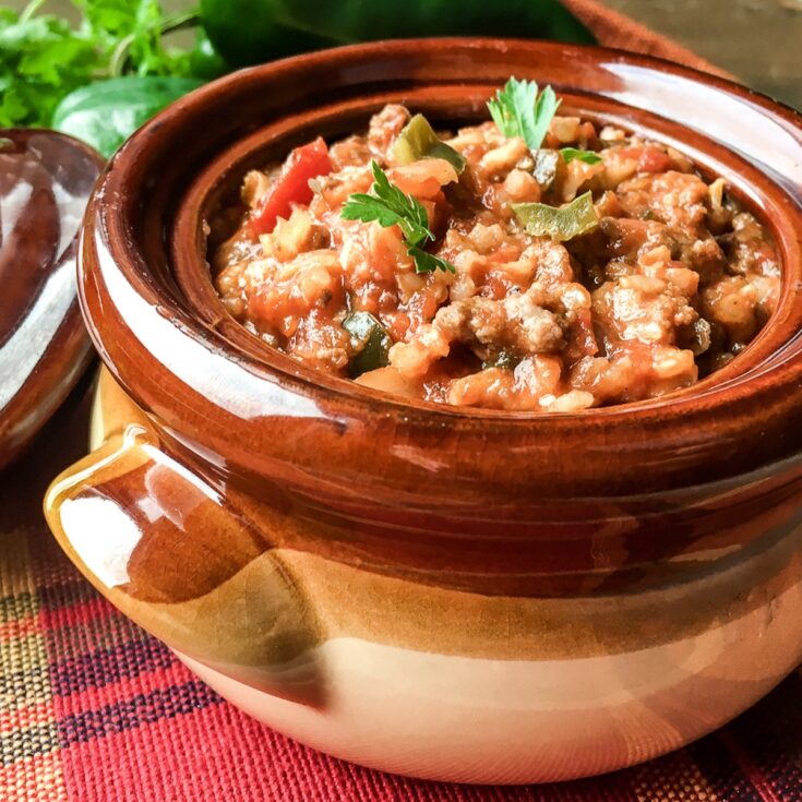 Instant Pot Stuffed Poblano Pepper Soup from Flavor Portal recipe in a brown stoneware bowl next to fresh veggies