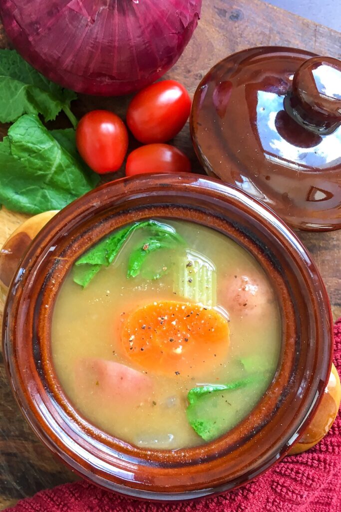 Instant Pot vegan vegetable soup from Flavor Portal recipe in brown stoneware bowl beside fresh vegetables