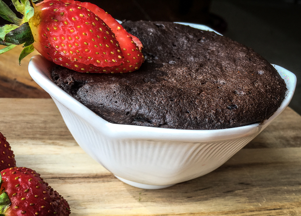 side view Keto Chocolate Mug Cake from Flavor Portal recipe garnished with sliced fresh strawberries