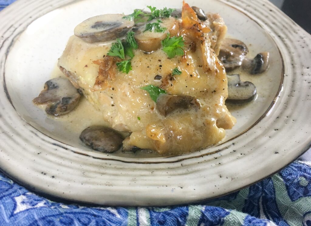 keto creamy chicken thighs from Flavor Portal recipe on a white plate