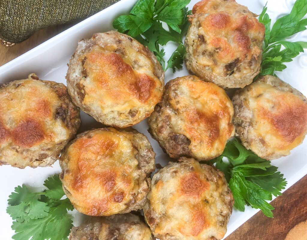 keto meatloaf muffins from Flavor Portal recipe on a white platter garnished with parsley