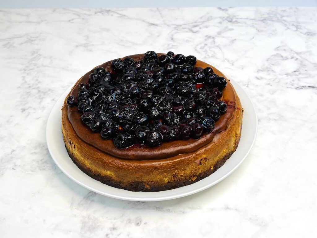 keto blueberry jamboree cheesecake with blueberry sauce topping