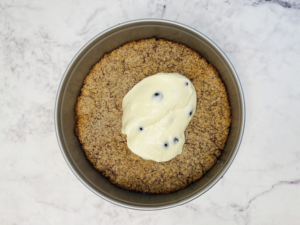 keto blueberry jamboree cheesecake crust with a little cheesecake filling on top