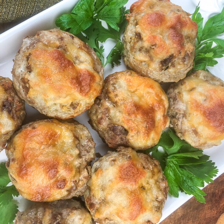 keto meatloaf muffins from Flavor Portal recipe on a white platter garnished with parsley