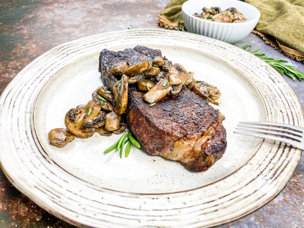 keto strip steak from Flavor Portal recipe topped with sauteed mushrooms