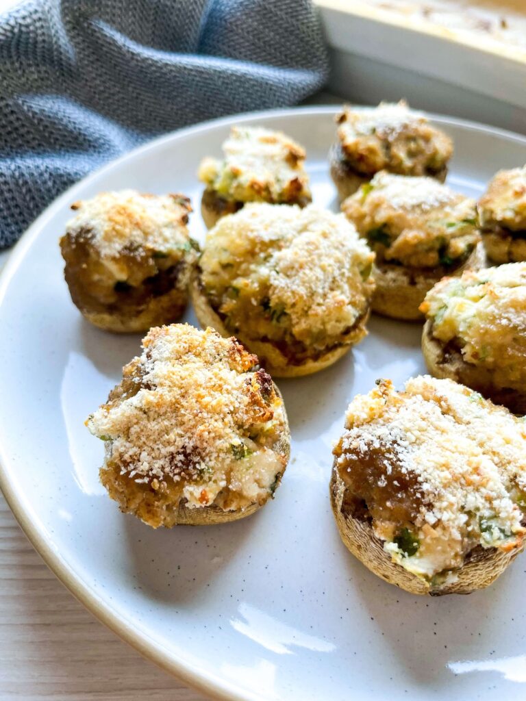 array of herbed cream cheese stuffed mushrooms from Flavor Portal recipe on a white plate