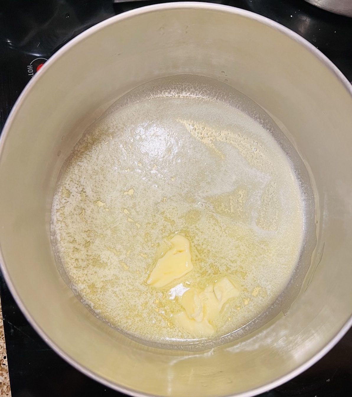 melted butter in a saucepan for Valentine rice krispie treats Flavor Portal recipe