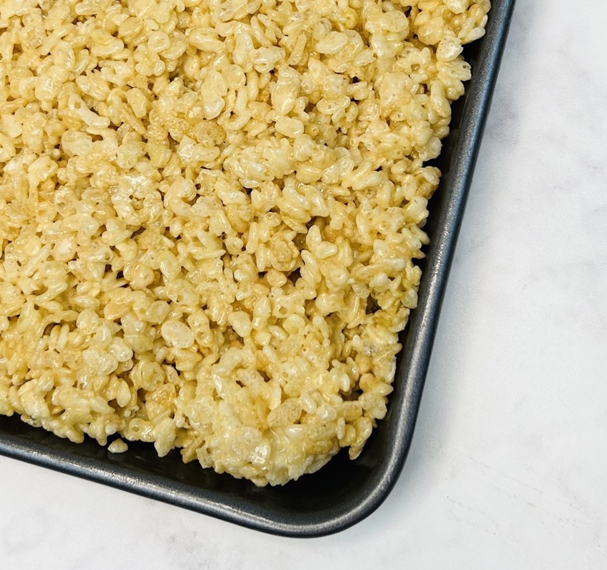 mixture for Valentine rice krispie treats from Flavor Portal recipe pressed into a pan
