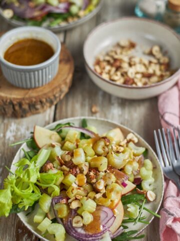 Apple Celery Hazelnut Salad Recipe in a plate with the combination of crisp apples, celery root and fresh hazelnut