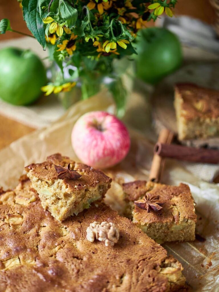 cinnamon apple blondies from Flavor Portal recipe on paper with apples and cinnamon sticks