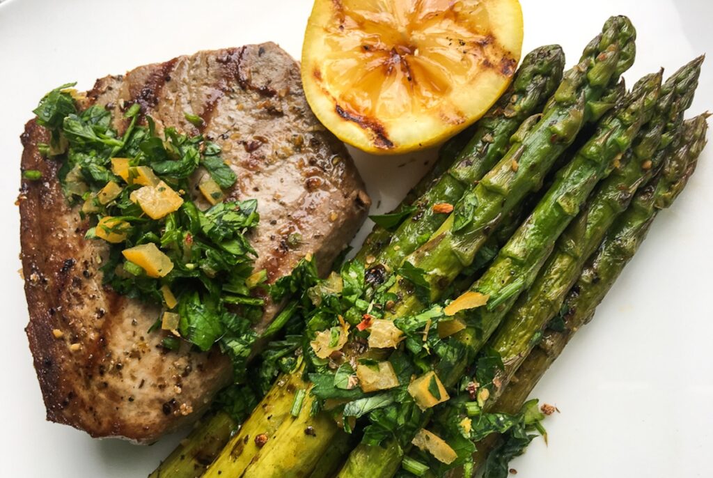 grilled marinated asparagus from Flavor Portal recipe with steak and grilled lemon half