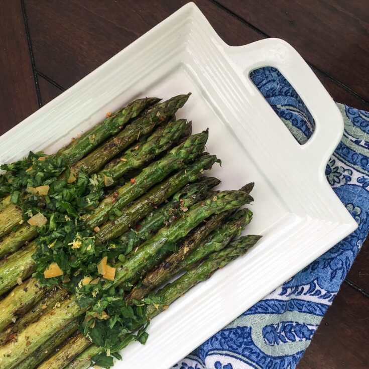 grilled marinated asparagus from Flavor Portal recipe on a white platter