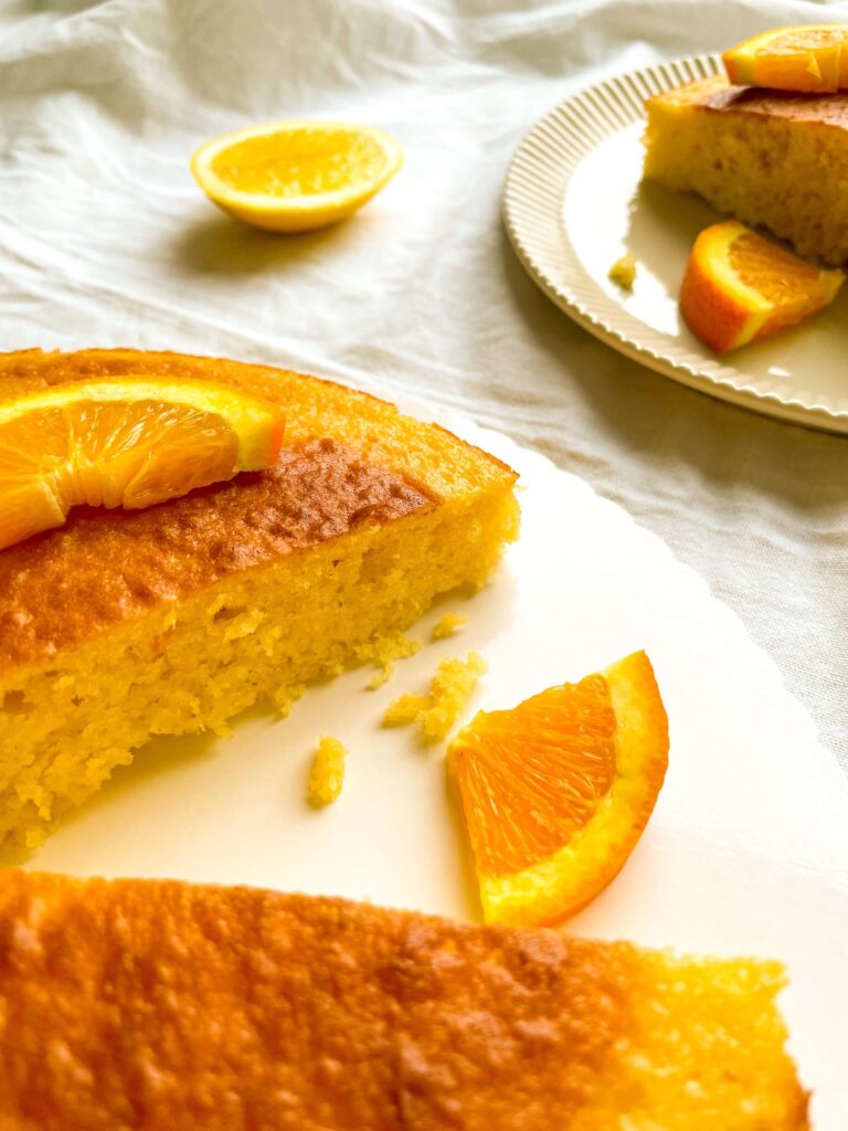 orange lemon yogurt cake from Flavor Portal recipe garnished with orange slices on a plate